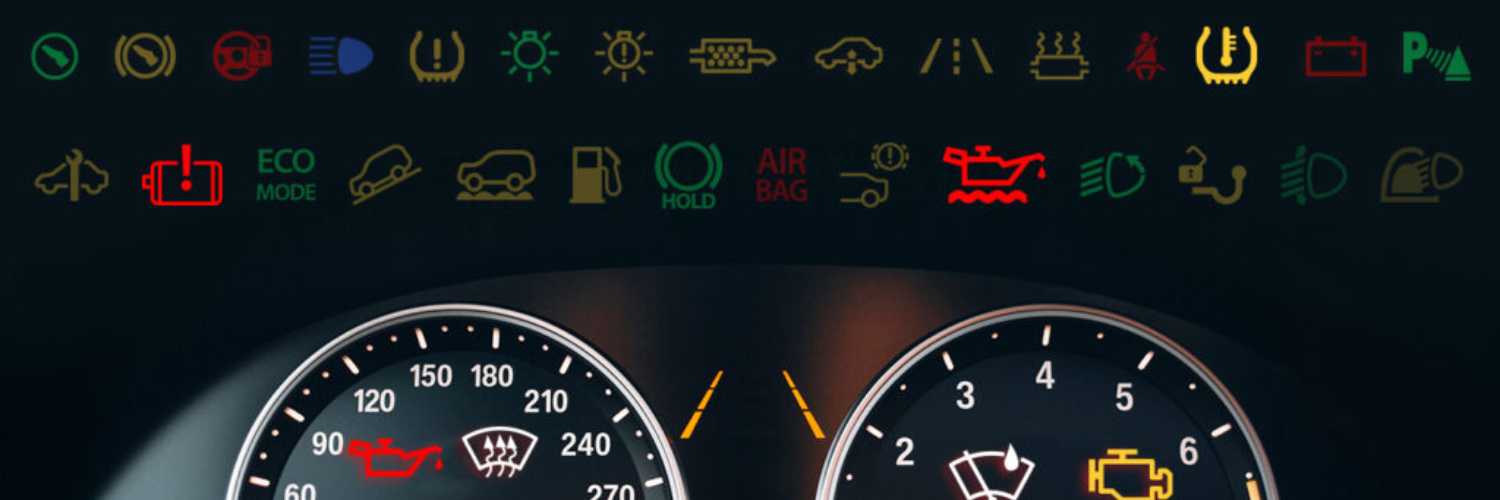 close up of car dashboard with collection of fault code icons lighting up