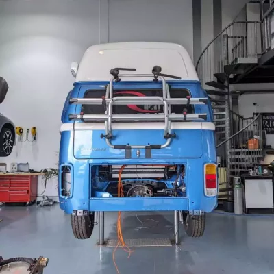 a blue volkswagen van in a garage